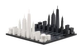 This image provided by Skyline Chess shows a chess set with pieces as iconic skyline buildings. Splurge on Skyline Chess' sets of iconic cities, including London, Tokyo, New York and Los Angeles, in stainless steel, acrylic or bronze. (AP)