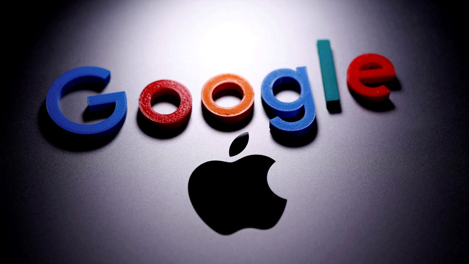 A 3D printed Google logo is placed on the Apple Macbook in this illustration taken April 12, 2020. REUTERS/Dado Ruvic/Illustration/File Photo
