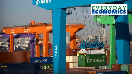 A crane lifts a shipping container at an automated container port in Tianjin, China, Jan. 16, 2023.