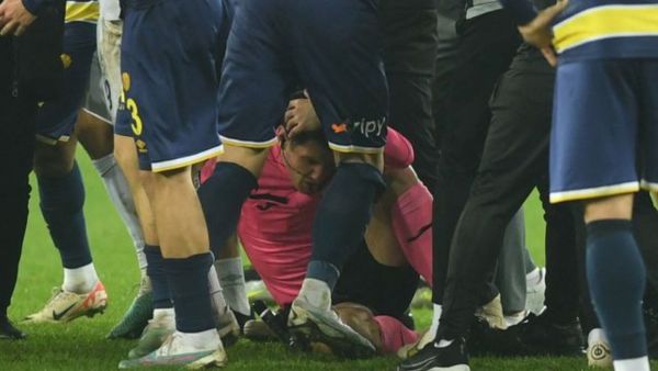 Referee Halil Umut Meler lies on the ground at the end the Turkish Super Lig soccer match between MKE Ankaragucu and Caykur Rizespor. (Reuters)