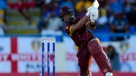 West Indies' captain Shai Hope hits a four against England during the first ODI cricket match at Sir Vivian Richards Stadium in North Sound, Antigua and Barbuda. (AP)