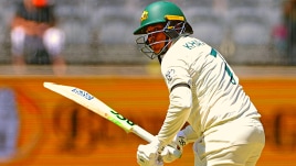 Usman Khawaja of Australia bats on the first day of the first cricket test between Australia and Pakistan in Perth, Australia.
