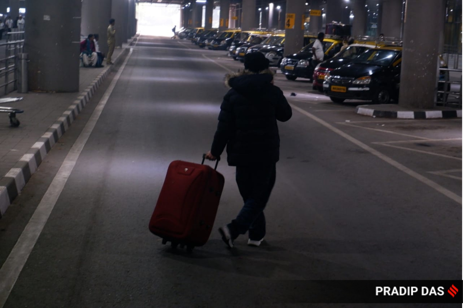 A passenger of the charter plane, which was grounded in France for four days over suspected human trafficking, comes out of the Mumbai airport on Tuesday. (Express Photo)