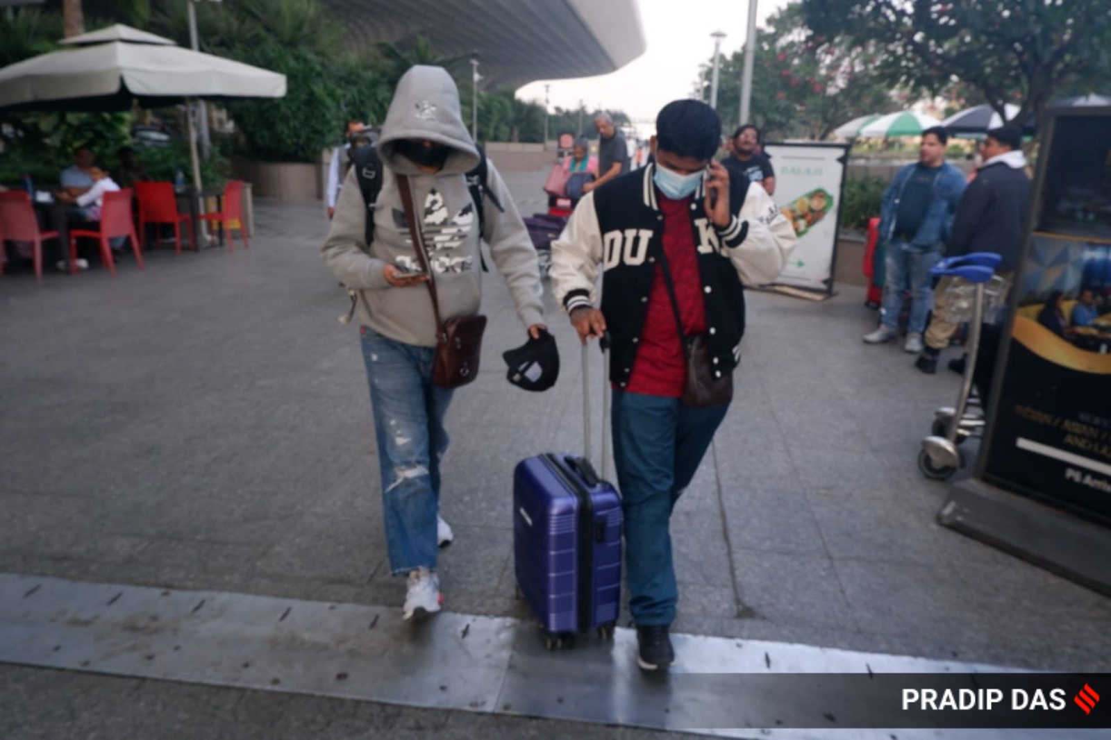 Passengers of the charter plane, which was grounded in France for four days over suspected human trafficking, come out of the Mumbai airport on Tuesday. (Express Photo)