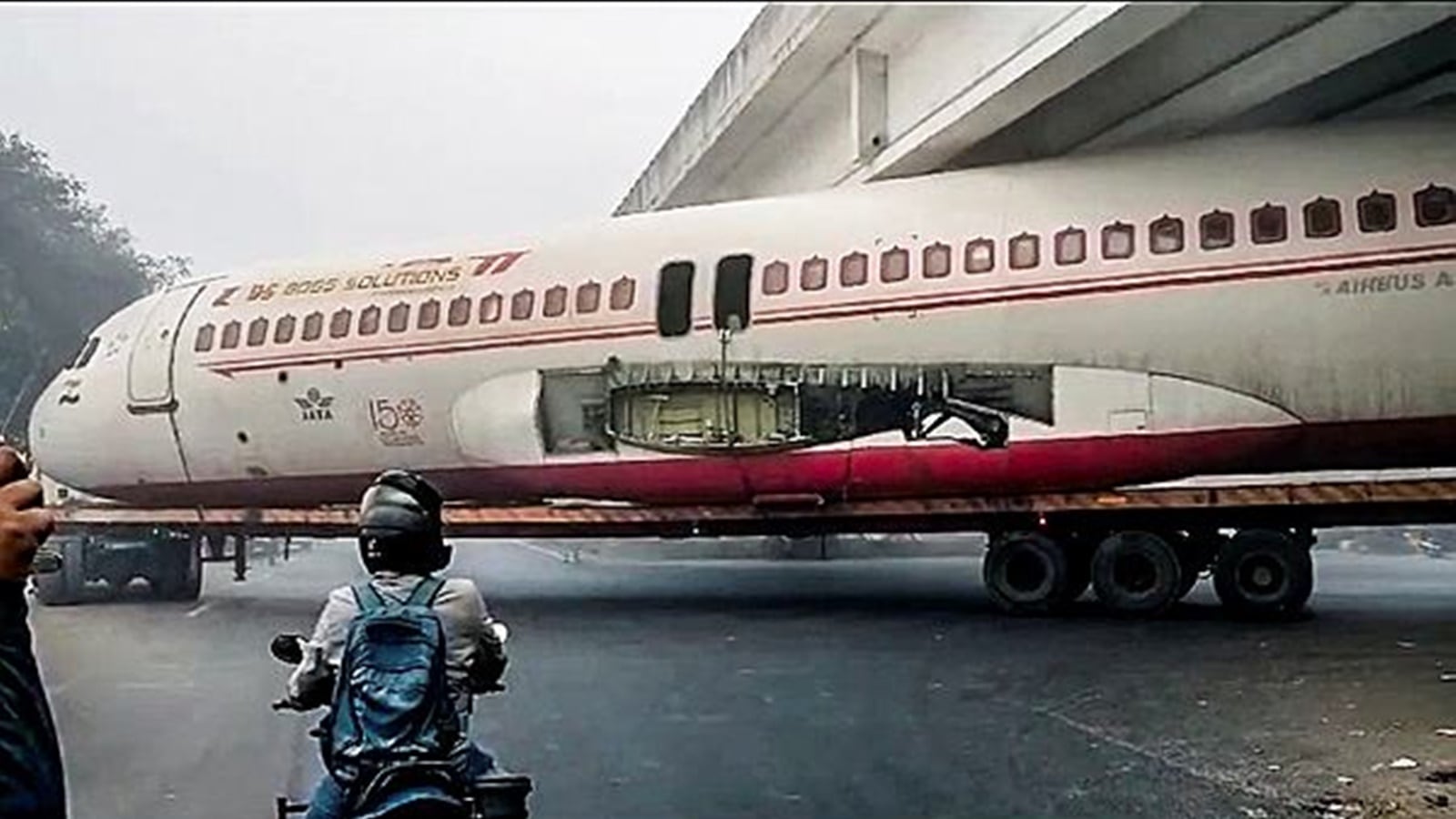 Watch Scrapped plane on truck gets stuck beneath bridge in Bihar’s