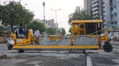 Ahmedabad Municipal Corporation, ahmedabad waterlogging, asphalt roads, three-phased project, indian express newss