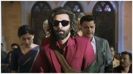 Ranbir kapoor, Rashmika Mandanna and Anil Kapoor in a still from Animal.