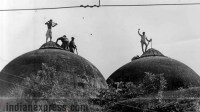 Kar Sewak atop the domes of Babri Masjid. (Source: Express archive photo by Mohan Bane)