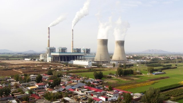 Guohua Power Station, a coal-fired powerfulness  plant, operates successful  Dingzhou, Baoding, successful  the bluish   China's Hebei province, Nov. 10, 2023. (AP)