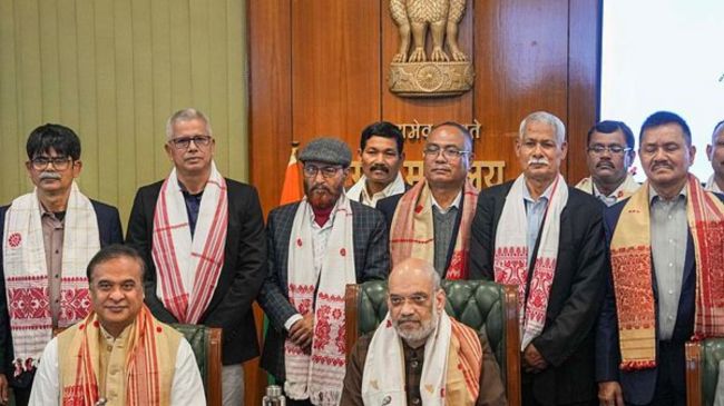 Union Home Minister Amit Shah and Assam Chief Minister Himanta Biswa Sarma with members of United Liberation Front of Asom (ULFA) during signing of a peace accord between ULFA and the central and Assam governments