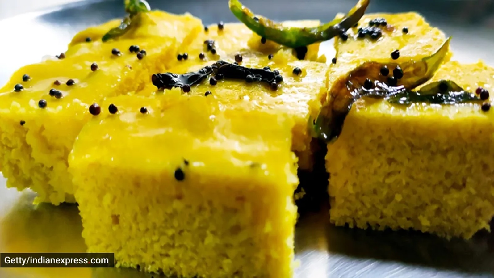 Indian popular Gujrati breakfast dish White Dhokla, Khatta Dhokla, Rice and  Urad Dal Khaman. Also known as Instant Rava Dhokla. served with ketchup  Stock Photo - Alamy