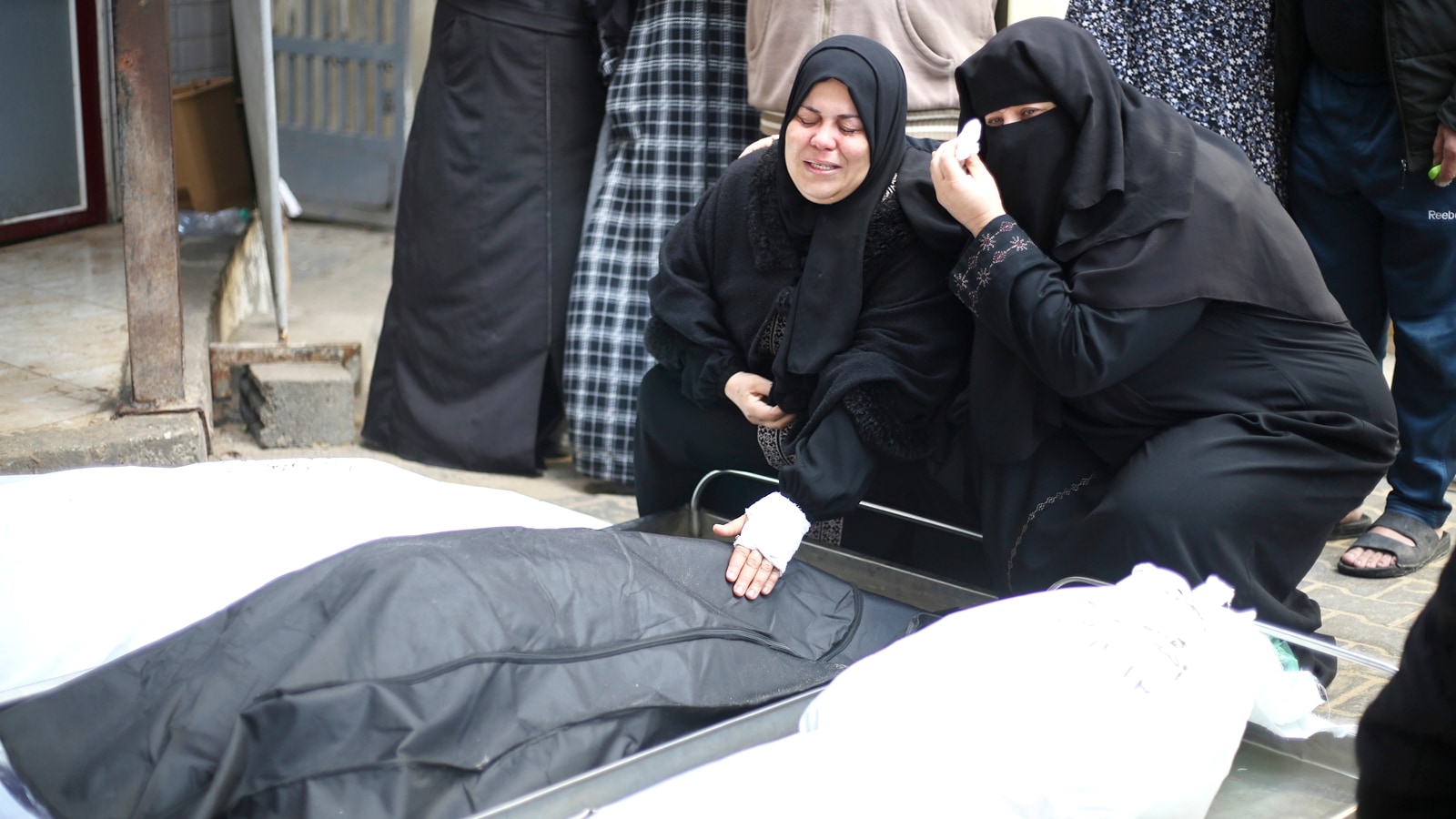 Palestinian women mourn relatives killed in the Israeli bombardment of the Gaza Strip in Rafah on Thursday, Dec. 14, 2023. (AP Photo/Hatem Ali)