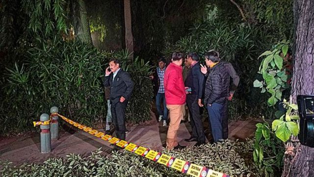 Police and other officials near the Embassy of Israel after Delhi Police received a call about a blast near the embassy, in New Delhi district, Tuesday evening, Dec. 26, 2023. (PTI Photo)