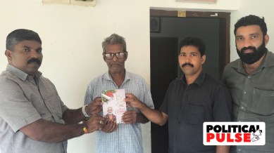 A Christmas card with PM Narendra Modi's greetings delivered to Muthuplackal Joseph and his son Siju by BJP leaders Aji Kumar and Arun Thomas in Kannur. (Express Photo)