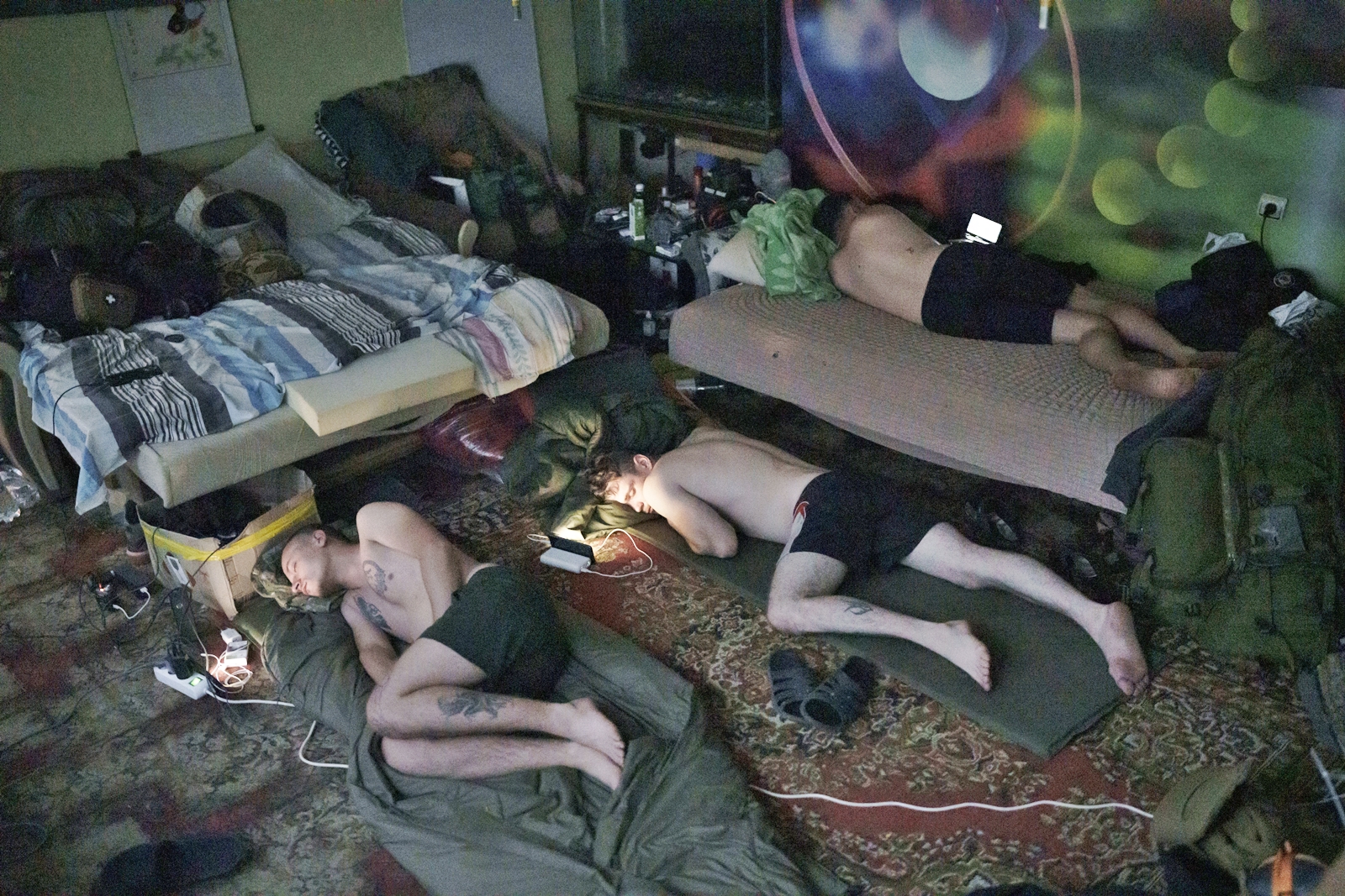 Ukraine Special Operations Forces soldiers sleep next to their phones in Kherson region, Ukraine, Friday, June 16, 2023. (AP Photo/Felipe Dana)
