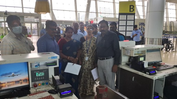 Male Passenger Using Baggage Check Weighing Machine at Airport