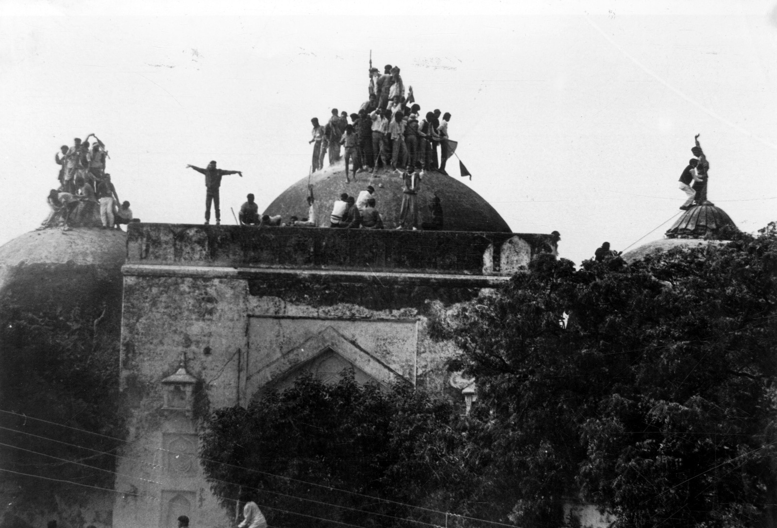 Kar sevaks atop the Babri masjid shortly before it was demolished on December 6, 1992. Express archive photo *** Local Caption *** Kar sevaks atop the Babri masjid shortly before it was demolished on December 6, 1992.