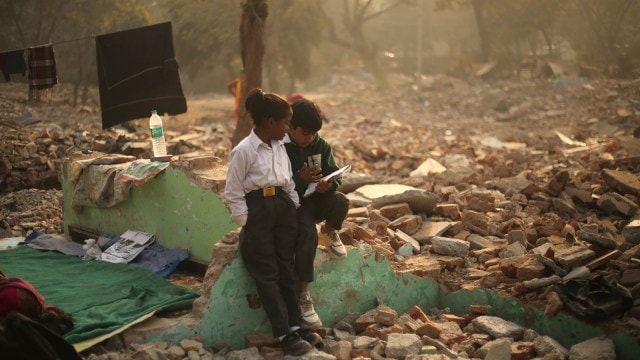 At debris of their demolished homes, Delhi schoolchildren pick up the pieces