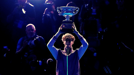 Jannik Sinner of Italy holds the Norman Brookes Challenge Cup aloft after defeating Daniil Medvedev of Russia in the men's singles final at the Australian Open tennis championships at Melbourne Park, in Melbourne, Australia, Sunday, Jan. 28, 2024. (AP Photo