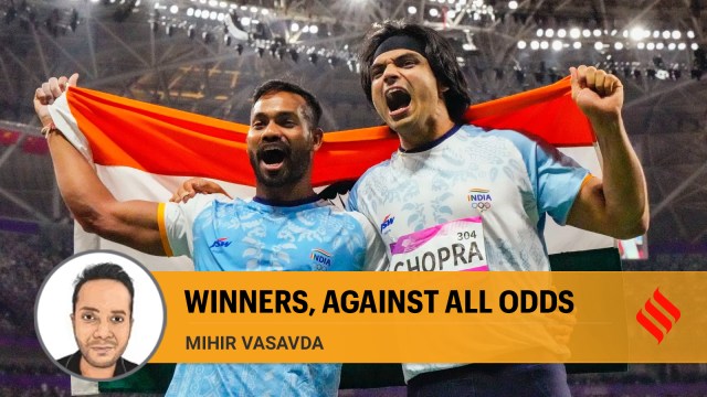 Neeraj Chopra and Kishore Kumar Jena celebrate after securing gold and silver medal respectively in the Men's Javelin Throw Final event at the 19th Asian Games held in Hangzhou, China in October 2023. (PTI file)