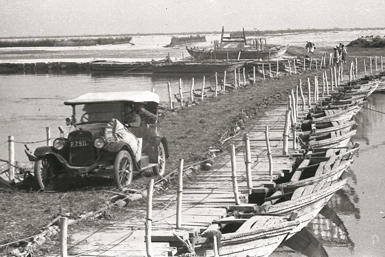 Grandparents' Model A Ford crossing the pontoon bridge in 1933 (Credit: RC Alter)