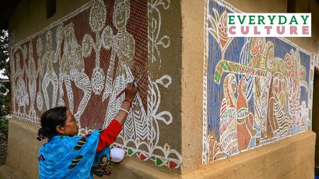 Happy Makar Sankranti 2024: An artist paints a 'rangoli' on the wall of her house on the eve of the Hindu festival Makar Sankaranti, in Lankamura village of Agartala, Tuesday, Jan. 9, 2024.