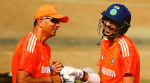 India's Axar Patel and coach Rahul Dravid during practice REUTERS