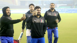 Rashid Khan shares a light moment with his Afghanistan teamamtes ahead of their first T20 match against India at the PCA stadium in Mohali (Express photo by Jasbir Malhi)