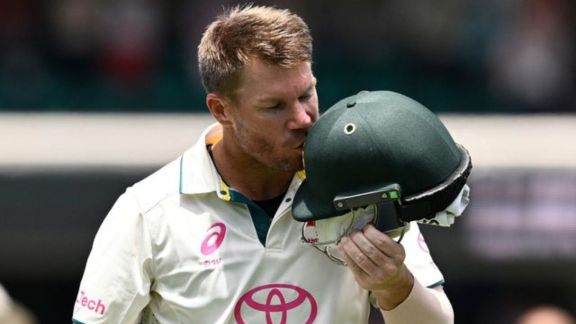 Australia's David Warner kisses the coat of arms on his helmet as he leaves the field in his last test match after being dismissed off the bowling of Pakistan's Sajid Khan. (Reuters)