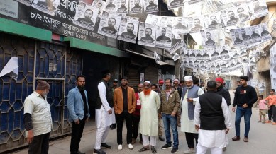 Bangladesh election workers sit on a bench as police personnel stand guard outside a polling station in Dhaka, Bangladesh, Sunday, Jan. 7, 2024. (AP/PTI)