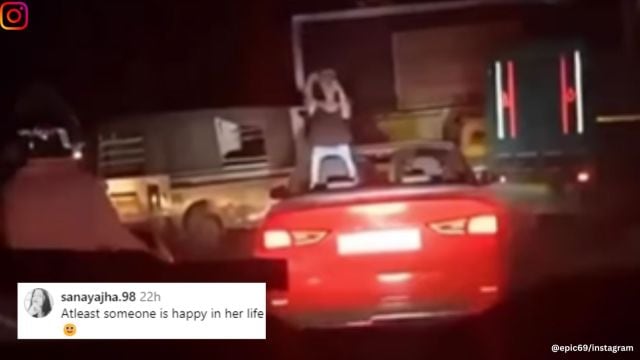 Woman dances in moving car for boyfriend.