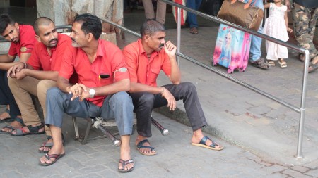 Mumbai coolie, Mumbai coolie life, Mumbai railway stations, amenities at Mumbai railway stations, Mumbai coolie news, railway stations icons, amenities for passengers improve, Mumbai LTT, 1983 Bollywood blockbuster Coolie, Amitabh Bachchan, indian express news