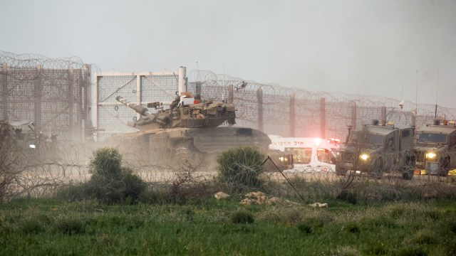 A tank manoeuvres along the Israel-Gaza border fence, amid the ongoing conflict between Israel and the Palestinian Islamist group Hamas, in Israel, January 22, 2024. (Reuters)