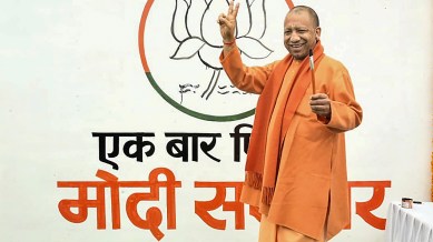 BJPs slogan writing campaign, Yogi Adityanath, Yogi new slogan, BJP slogans for 2024, bjp lok sabha polls campaign, Uttar Pradesh, indian express news