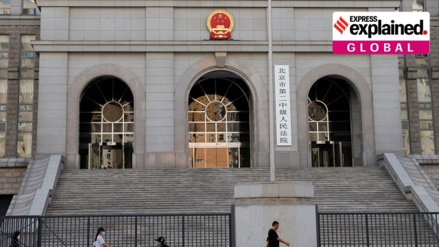 People walk past one of the entrances of Beijing No. 2 Intermediate People's Court where Australian writer Yang Hengjun was expected to face trial on espionage charges, in Beijing, China May 27, 2021.