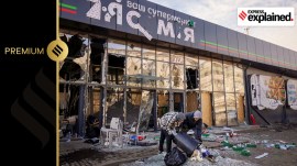 Locals remove debris from a supermarket that was damaged, when a Russian missile strike destroyed a train station in Kostyantynivka, Ukraine, on February 25, 2024.