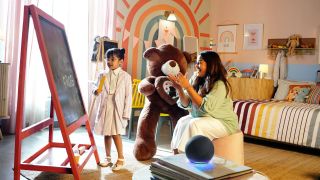 Image of a mother and child in a room with an Amazon alexa device.