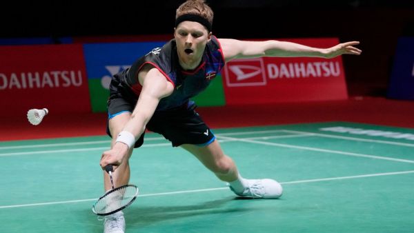 Denmark's Anders Antonsen return a shot to China's Lei Lan Xi during the men's singles match in the Indonesia Masters badminton tournament at the Istora Stadium in Jakarta, Indonesia. (AP)