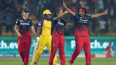 Royal Challengers Bangalore’s Asha Sobhana celebrates with teammates after taking the wicket of UP Warriorz' Kiran Navgire during a ‘Women’s Premier League (WPL) 2024’ T20 cricket match between Royal Challengers Bangalore and UP Warriorz, at M Chinnaswamy Stadium, in Bengaluru, Saturday, Feb. 24, 2024. (PTI Photo)