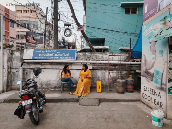 Camera sample photo taken with the Honor X9b. To women wearing yellow-coloured clothes next to a milk carton that is also yellow