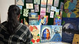 Ishita with her paintings, medals and certificates, chandigarh news, indian express