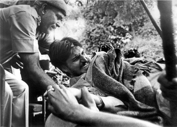 Rajeev Goswami being taken away by cops after he set himself on fire. He survived with 50% burns but never quite recovered from the injuries he sustained, and died at the age of 32 in 2004. 