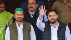 RJD leader Tejashwi Yadav with party MLA Tej Pratap Yadav and MP Manoj Kumar Jha comes out after Bihar Chief Minister Nitish Kumar-led NDA government in the state won a vote of confidence, during the first day of Budget session of the State Assembly, in Patna