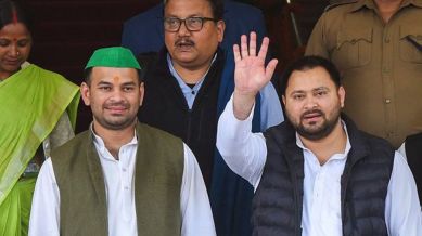 RJD leader Tejashwi Yadav with party MLA Tej Pratap Yadav and MP Manoj Kumar Jha comes out after Bihar Chief Minister Nitish Kumar-led NDA government in the state won a vote of confidence, during the first day of Budget session of the State Assembly, in Patna