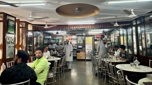 Despite its 106 years of history, Olympia has meticulously preserved its original interiors, including wooden counters, panelled walls, and marble-topped round dining tables