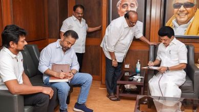 Tamil Nadu Chief Minister MK Stalin and state Minister Udhayanidhi Stalin with Makkal Needhi Maiam (MNM) leader Kamal Haasan during a meeting, at the DMK office in Chennai,