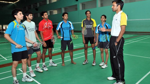 Badminton legend Pullela Gopichand giving tips to shuttlers like Sindhu, RMV Guru Sai Dutt, B Sai Praneeth in 2011. Express Photo