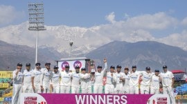Indian players celebrate with trophy after winning the fifth Test cricket match over England, in Dharamsala, Saturday, March 9, 2024. India win the five-match series 4-1. (PTI Photo)