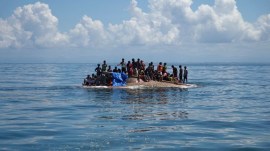 Rohingya refugees being rescued in the waters of West Aceh