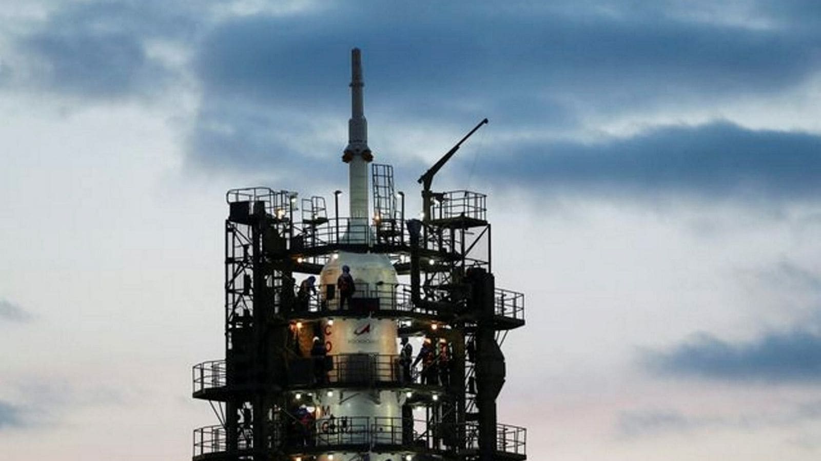 Specialists work near the Soyuz MS-25 spacecraft following its launch cancellation at the Baikonur Cosmodrome, Kazakhstan, March 21, 2024. REUTERS/Pavel Mikheyev
